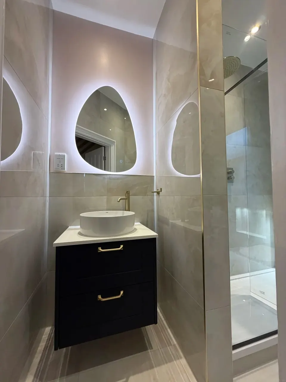 Modern vanity unit and illuminated bathroom mirror